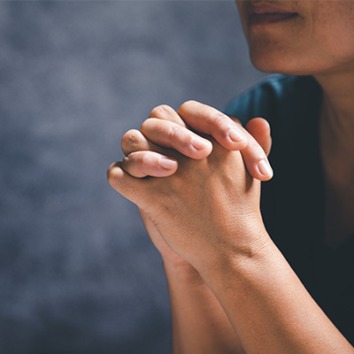 woman praying and blessed
